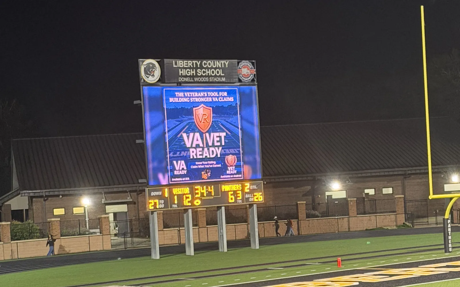 The Liberty County High School video board at Donell Woods Stadium showing a VA Ready and Vet Ready sponsor ad during a Panthers home game